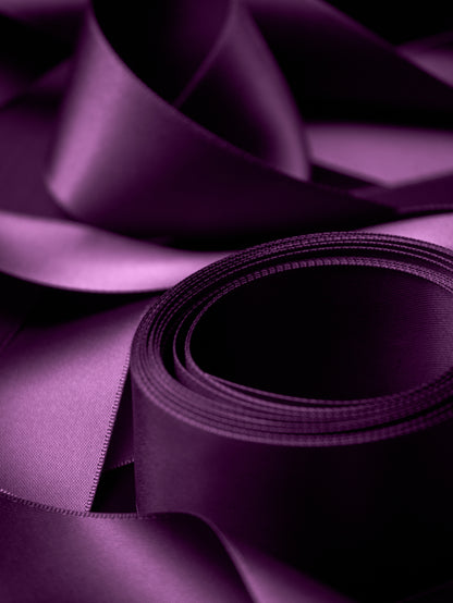 Plum 1.5 inch satin ribbon styled for luxury gift wrapping and elegant bows