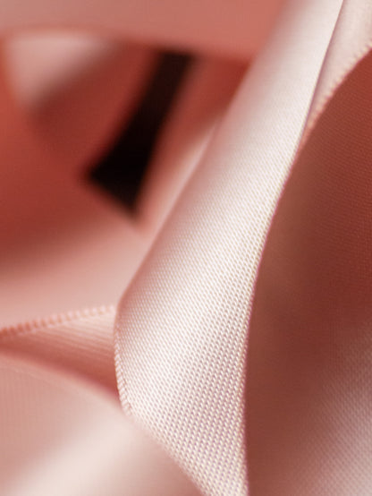 rose gold satin ribbon close up, double faced finish with soft metallic sheen